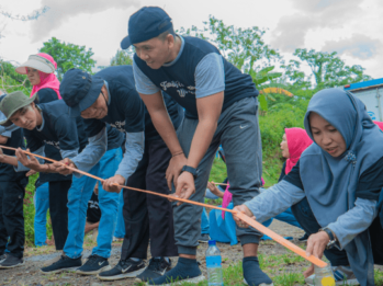 Indonesian team members working together during an outbound game.