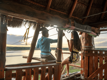 A participant gearing up to go down a zipline as part of a site activity in outbound Lombok.